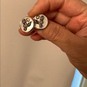 Sterling silver pierced earrings with blue topaz